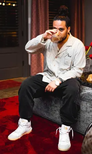 Russ wearing Rhude shirt