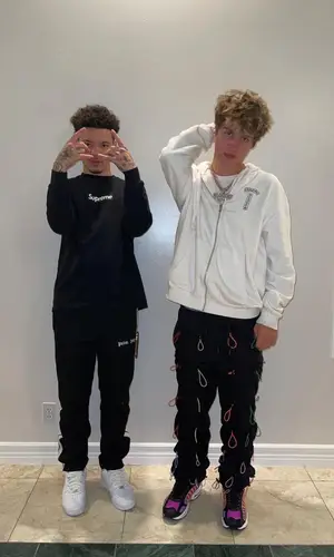 Lil Mosey’s Outfit in Supreme Sweatshirt, Palm Angels Pants & Louis Vuitton (2021)