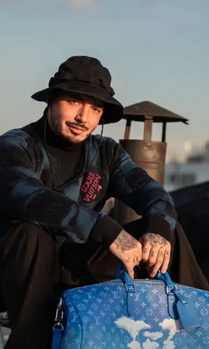 J Balvin wearing Louis Vuitton sweatshirt
