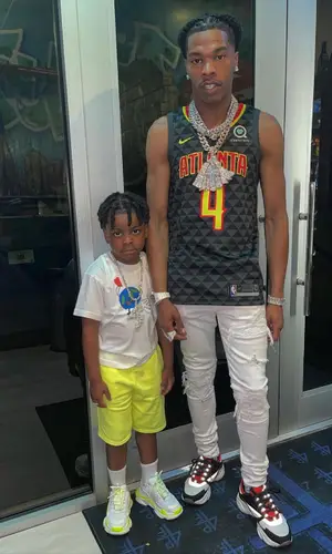 Lil Baby wearing Atlanta Hawks jersey