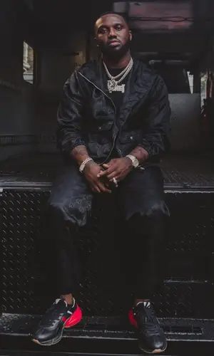 Headie One wearing Gucci jacket