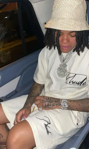 Young M.A wearing Rhude t-shirt