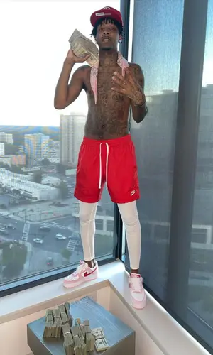 21 Savage wearing Nike shorts