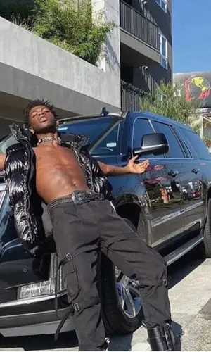 Lil Nas X wearing Cybergoth jewelry