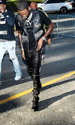 Meek Mill wearing Louis Vuitton bag