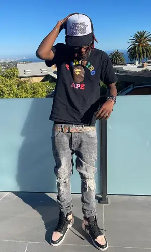 Dro Kenji wearing Gucci belt