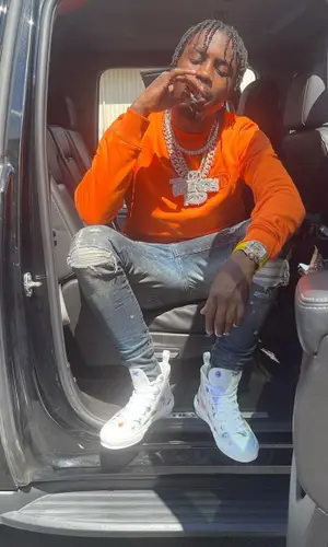 Lil Tjay wearing Dior sweatshirt
