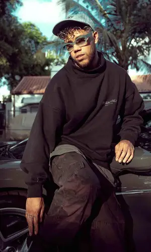 Jhay Cortez wearing Fear of God sweatshirt
