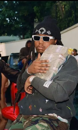 Takeoff wearing Louis Vuitton eyewear