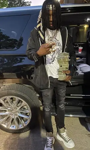 Polo G wearing Burberry scarf