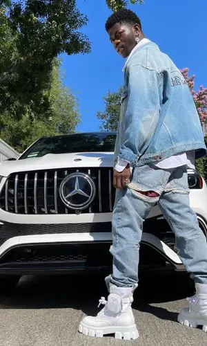 Lil Nas X’s Outfit in Balenciaga Jacket & Prada Boots (2021)
