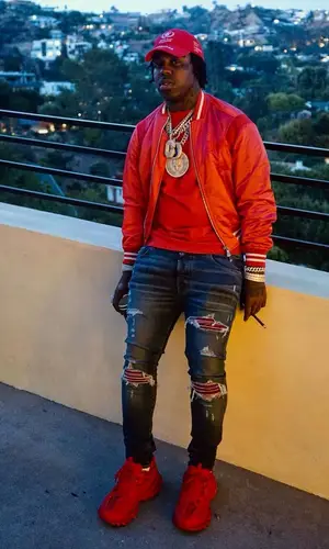 EST Gee wearing Balenciaga hat