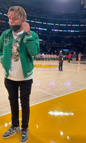 Cordae wearing Polo Ralph Lauren jacket