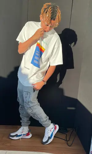 Cordae wearing Pyer Moss t-shirt