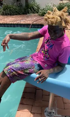 Kodak Black wearing Psycho Bunny t-shirt