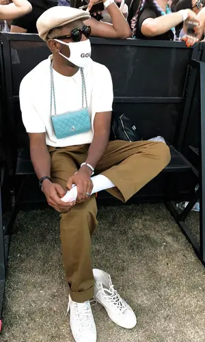 Tyler, The Creator’s Outfit in Golf Wang Pants, Converse Sneakers & Chanel Bag (2018)