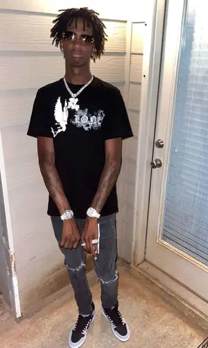 Yung Mal wearing Purple Brand jeans
