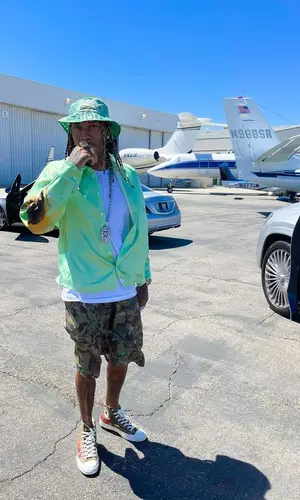 Tyga wearing Martine Rose shirt