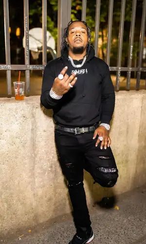 Rowdy Rebel wearing Dior belt