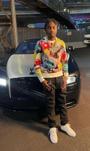 Lil Tjay wearing Dior sweater