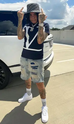Young M.A wearing Valentino t-shirt