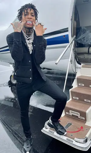 NLE Choppa wearing Dolce & Gabbana sweater