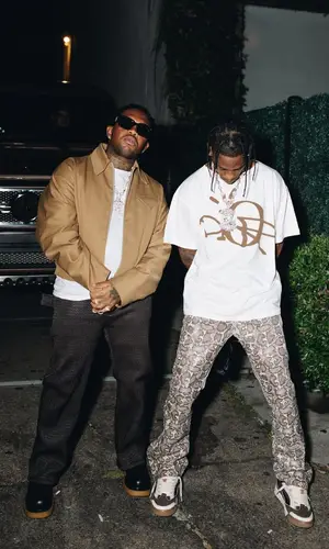 Mustard wearing Bottega Veneta jacket