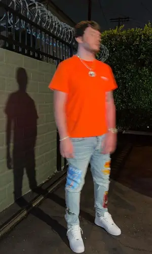 Murda Beatz wearing Amiri jeans