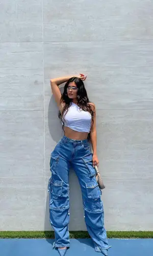 Kylie Jenner’s Outfit in Rick Owens Top, The Attico Jeans & Staud Bag (2021)