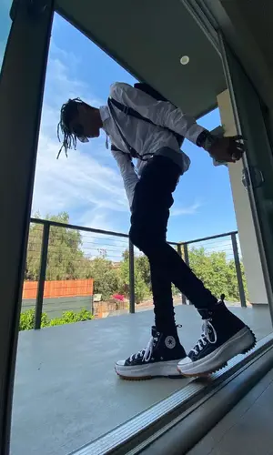 TheHxliday wearing Dr. Martens backpack