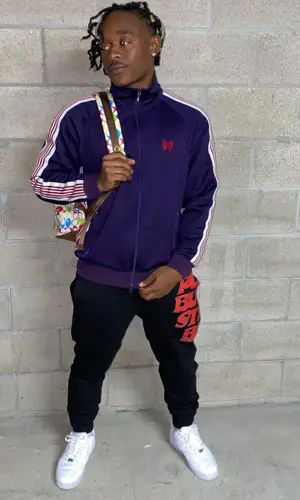 TyFontaine wearing Bape backpack