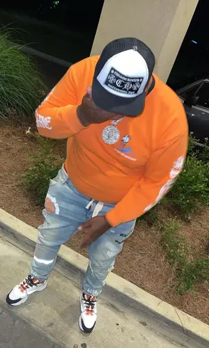 Big Yavo wearing Chrome Hearts hat