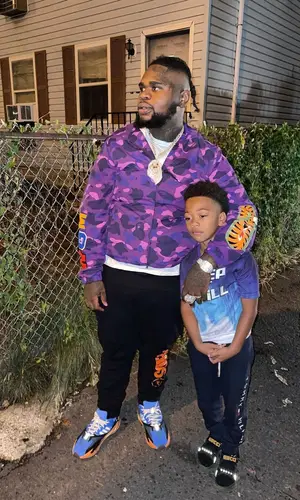 Fat Boy wearing Adidas sneakers