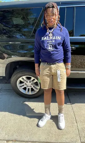 Lil Gotit wearing Dior belt