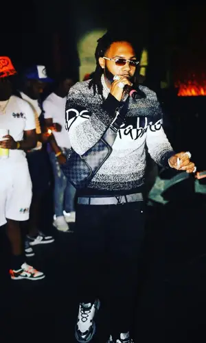 Money Man wearing Louis Vuitton belt