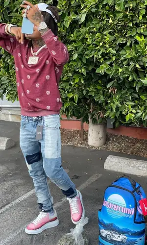 SpotemGottem wearing CPTL Denim jeans