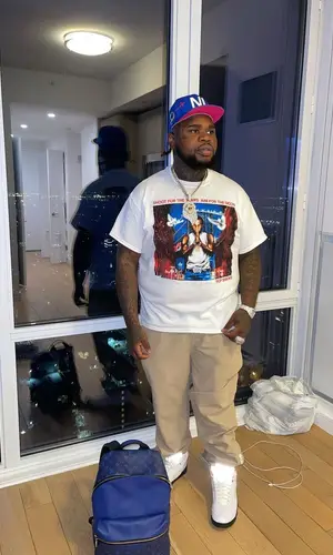 Fat Boy wearing Pop Smoke Merch t-shirt