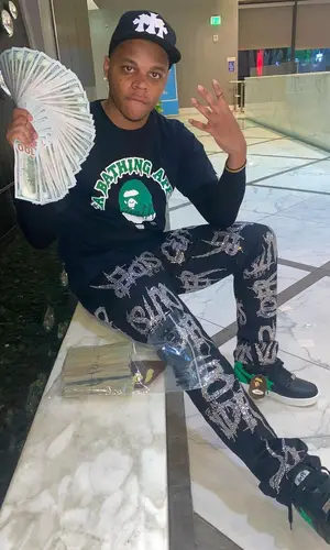 Fast Cash Jizzle wearing Bape t-shirt