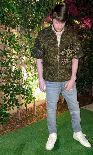 Murda Beatz wearing Givenchy shirt