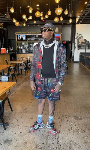 Lil Duke wearing Givenchy eyewear