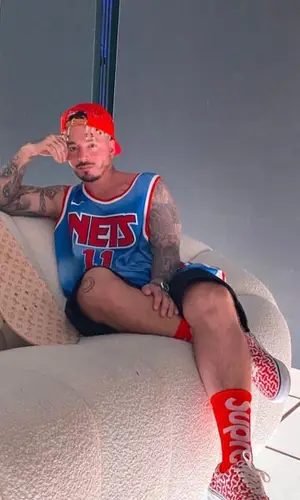 J Balvin wearing Louis Vuitton cap