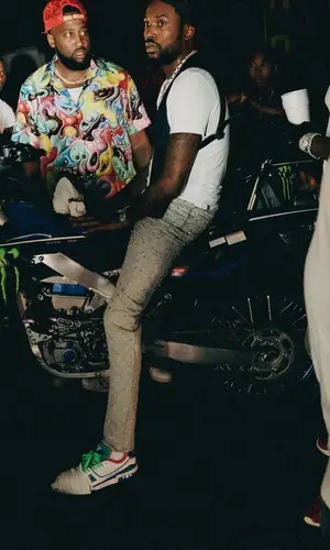 Meek Mill wearing Louis Vuitton jeans