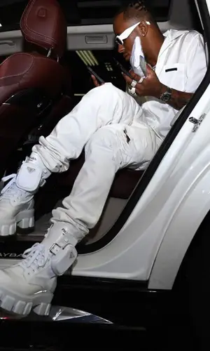Rich The Kid wearing Prada shirt