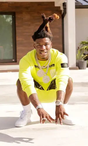 Hot Boii wearing Nike sneakers