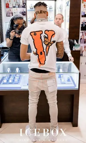 NLE Choppa’s Outfit in Juice Wrld Merch T-Shirt, Purple Brand Jeans & Vlone (2021)