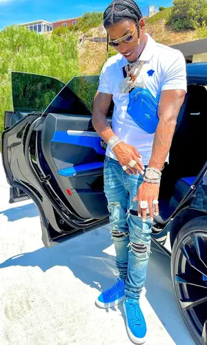 CJ So Cool wearing Versace bag