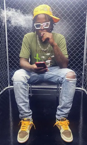 Ballout wearing Louis Vuitton eyewear