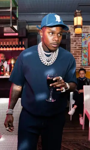 DaBaby wearing Issey Miyake trousers