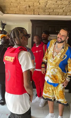 French Montana wearing Versace shirt