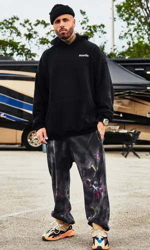 Nicky Jam wearing Vetements hoody
